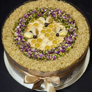 Honey cake with walnut, pistachio and honeycomb