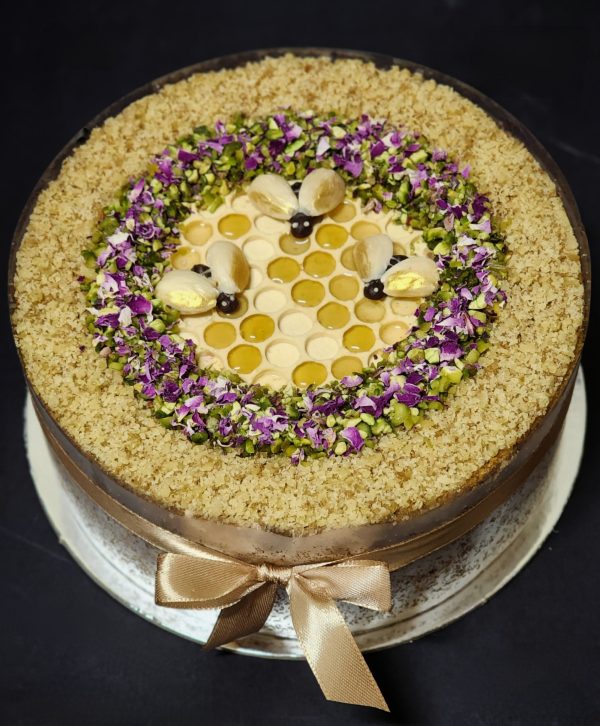 Honey cake with walnut, pistachio and honeycomb